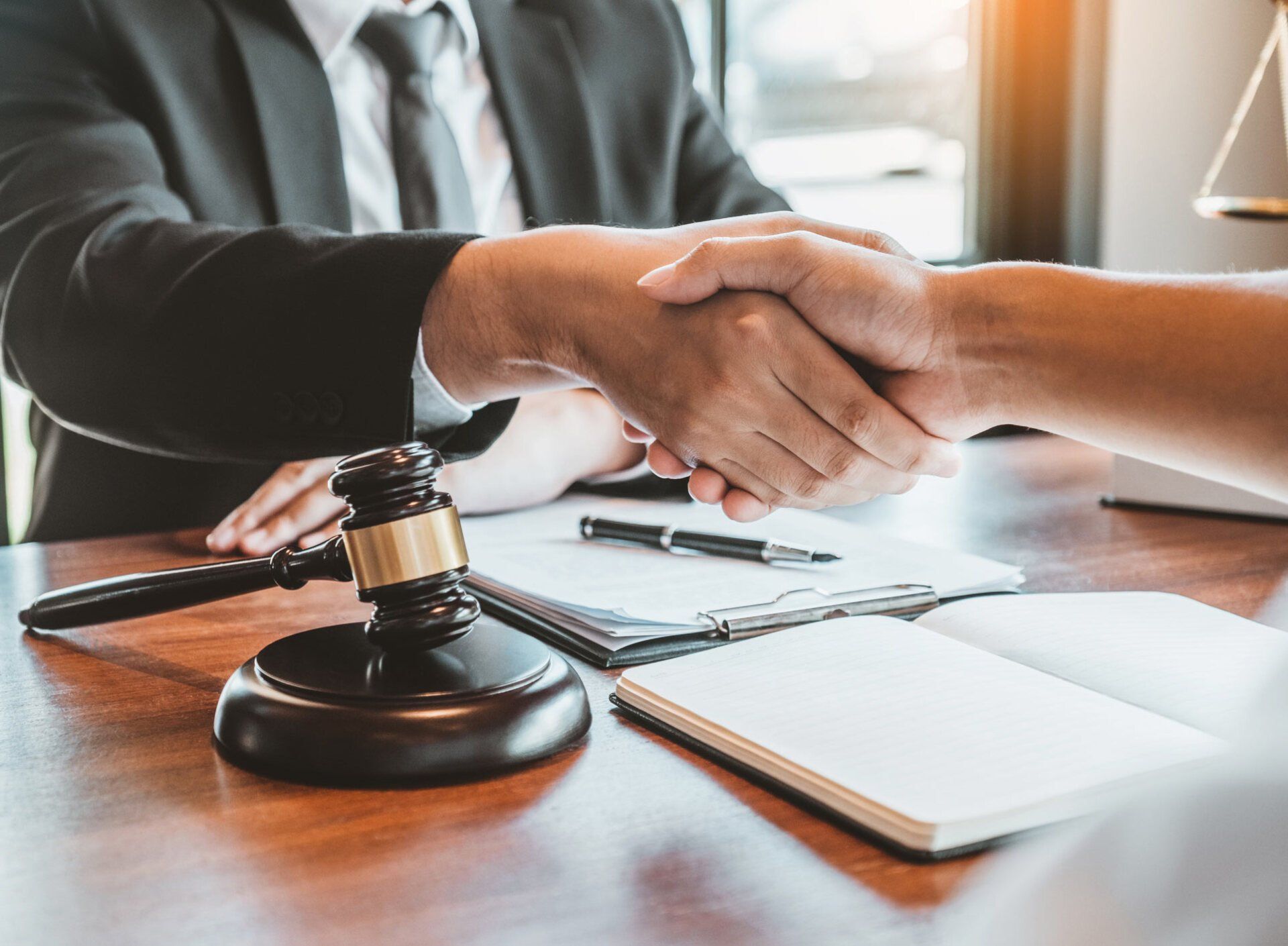 Lawyer And Client Hand Shaking — Goshen, NY — Owen Law Firm PLLC