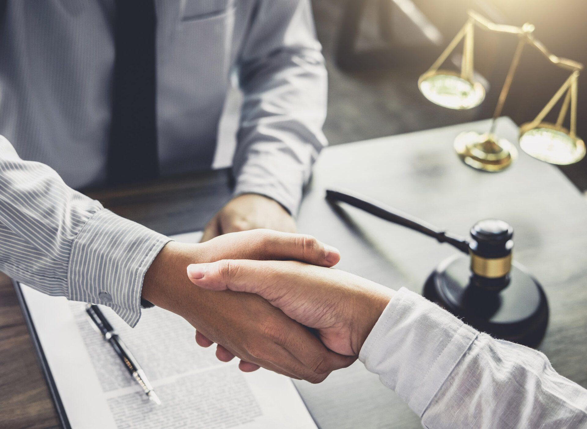 Lawyer And Man Handshaking — Goshen, NY — Owen Law Firm PLLC