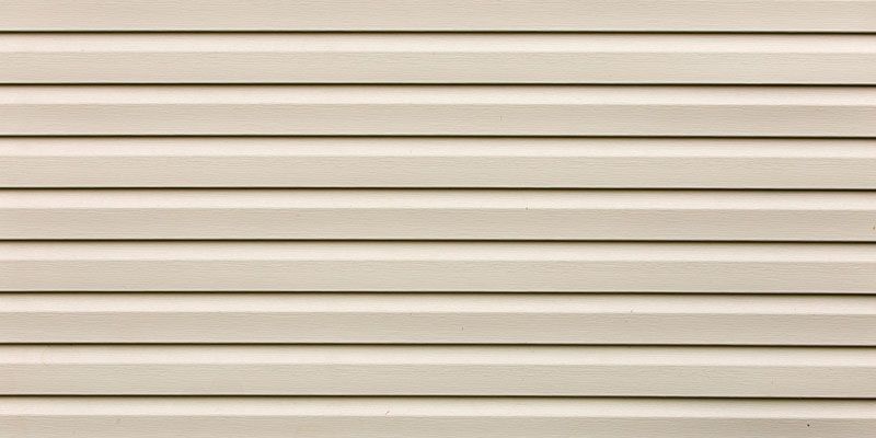 Tan horizontal siding.