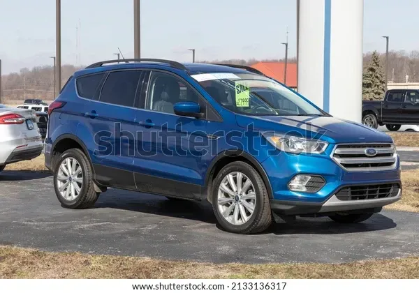 A payless shoesource store with a blue awning