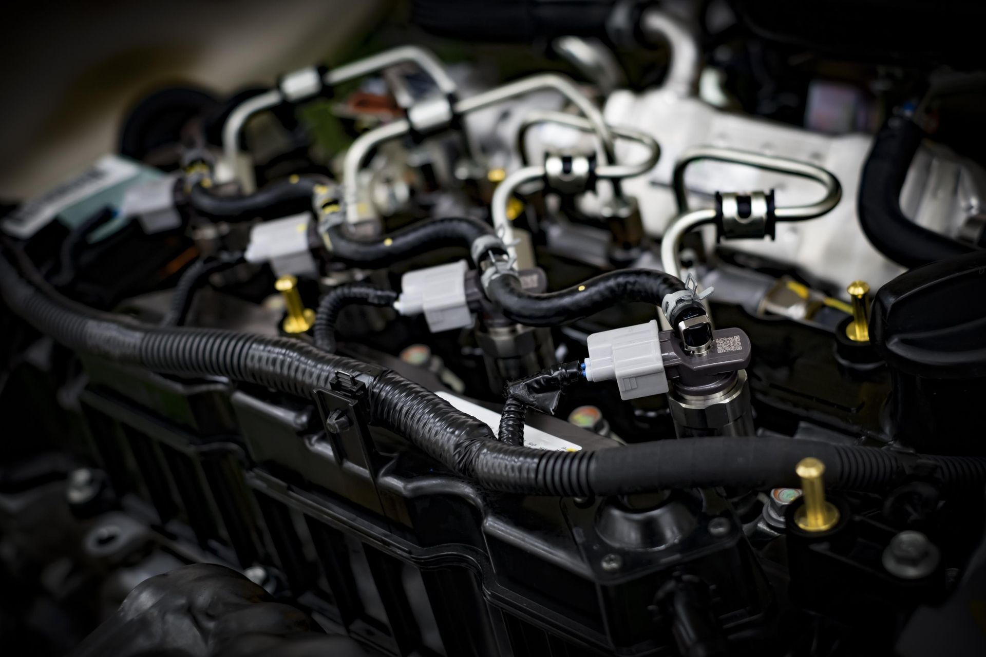 Close-up of a clean car engine showing fuel injectors.