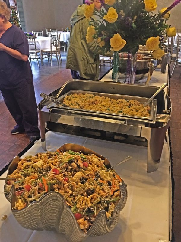 A buffet table with a variety of food on it