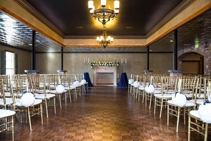 A large room with rows of chairs and a chandelier
