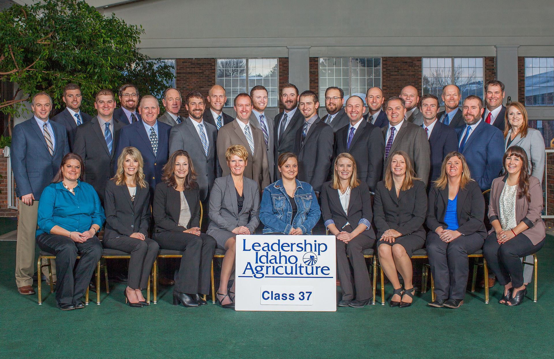 The Leadership Idaho Agriculture Class 37 group poses for a formal photograph in a courtyard.