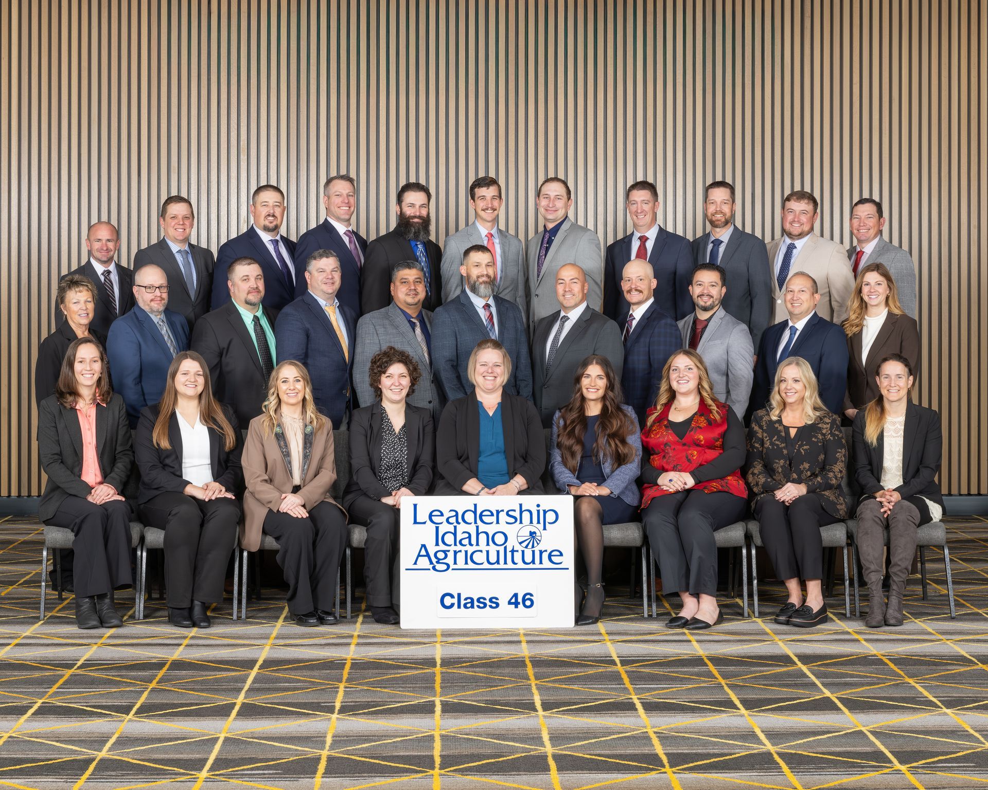 A large group of people posing for a photo at the Leadership Idaho Agriculture Class 46 graduation.