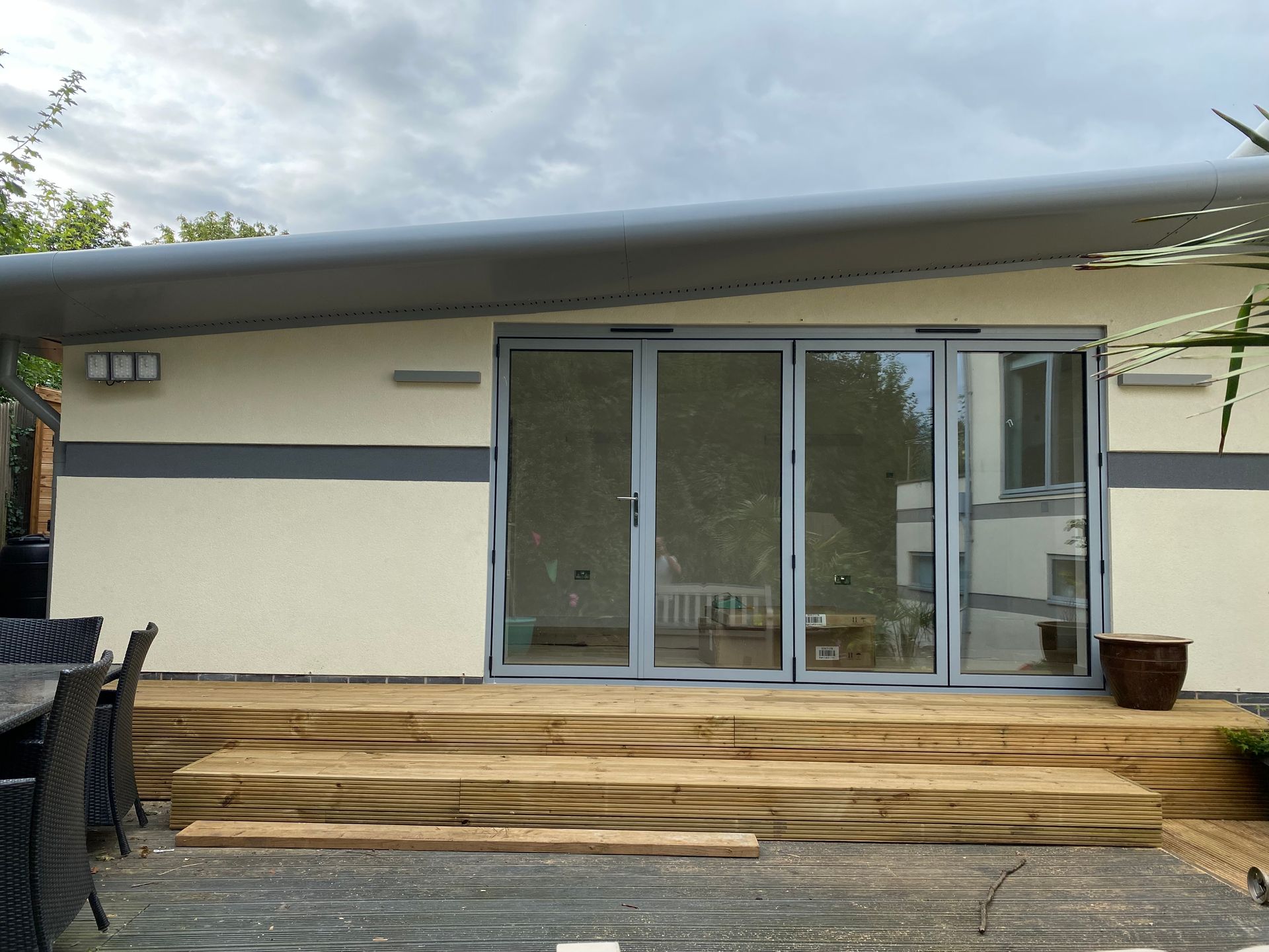 A white house with a large sliding glass door
