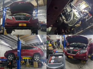 A red lexus is being worked on in a garage
