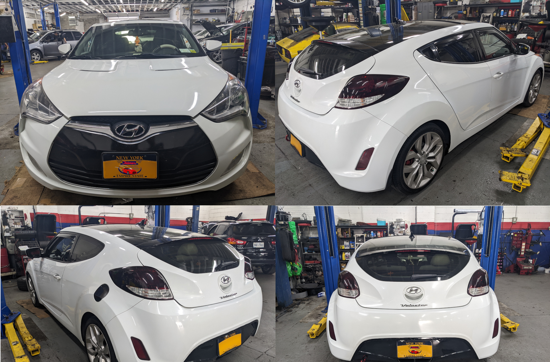 A white hyundai veloster is sitting on a lift in a garage.