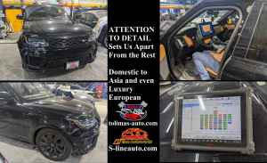 A black range rover is being repaired in a garage.