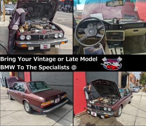 A man is working on a bmw with the hood open