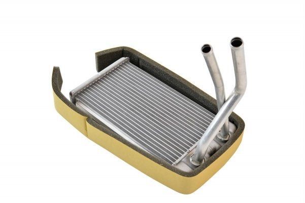 A radiator with two pipes attached to it on a white background