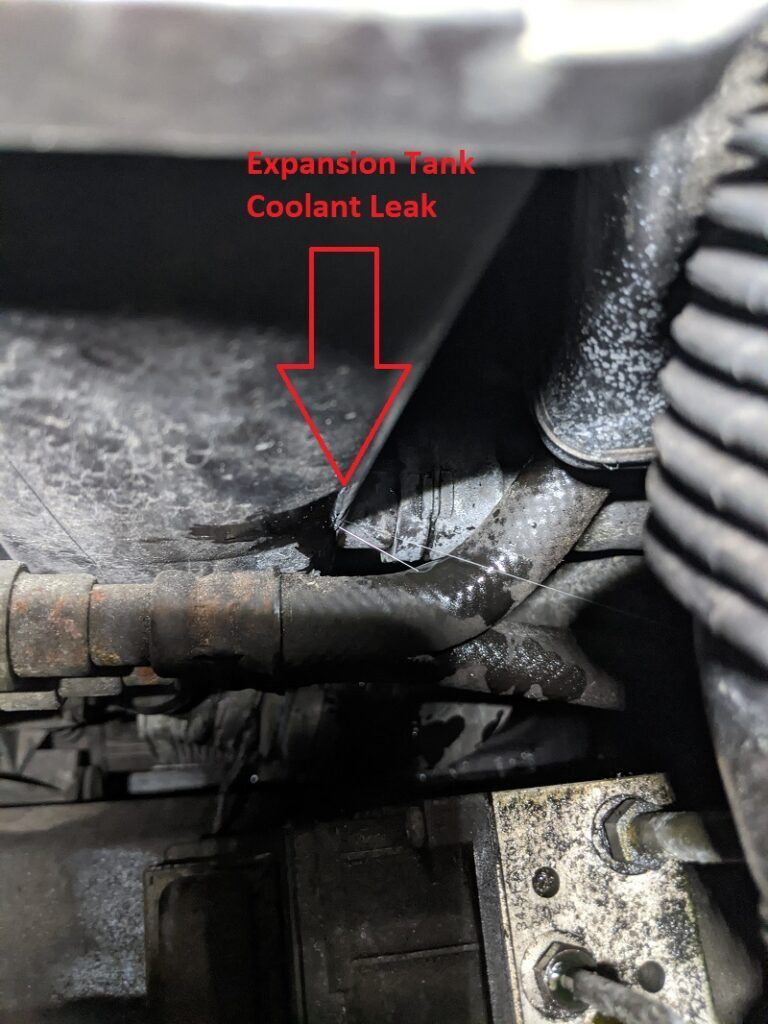 There is a coolant leak in the expansion tank of a car.