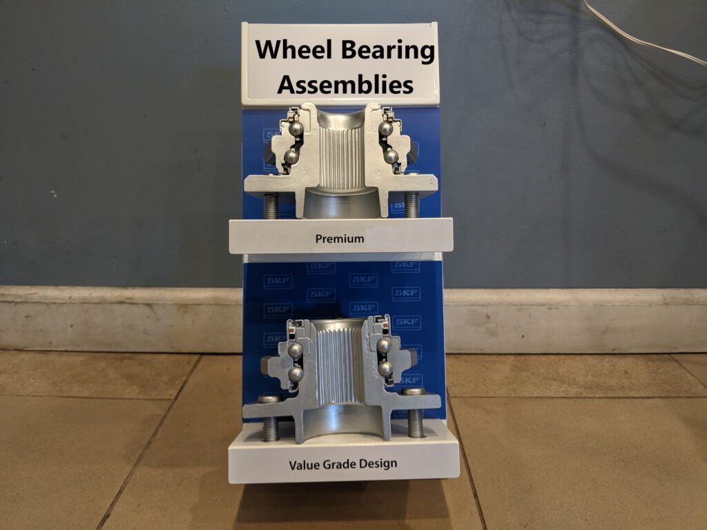 A display of wheel bearing assemblies on a tiled floor