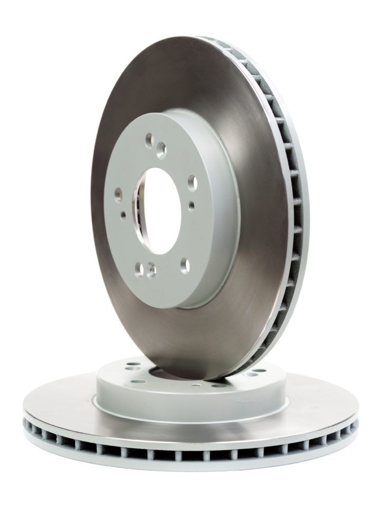 Two brake discs are stacked on top of each other on a white background