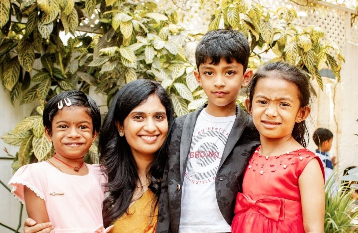 Happy children strike a pose for camera at Montessori at Bengaluru