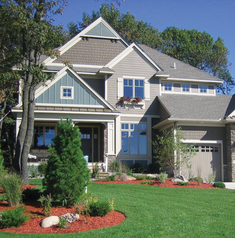 A white molding on the ceiling of a room with green walls.
