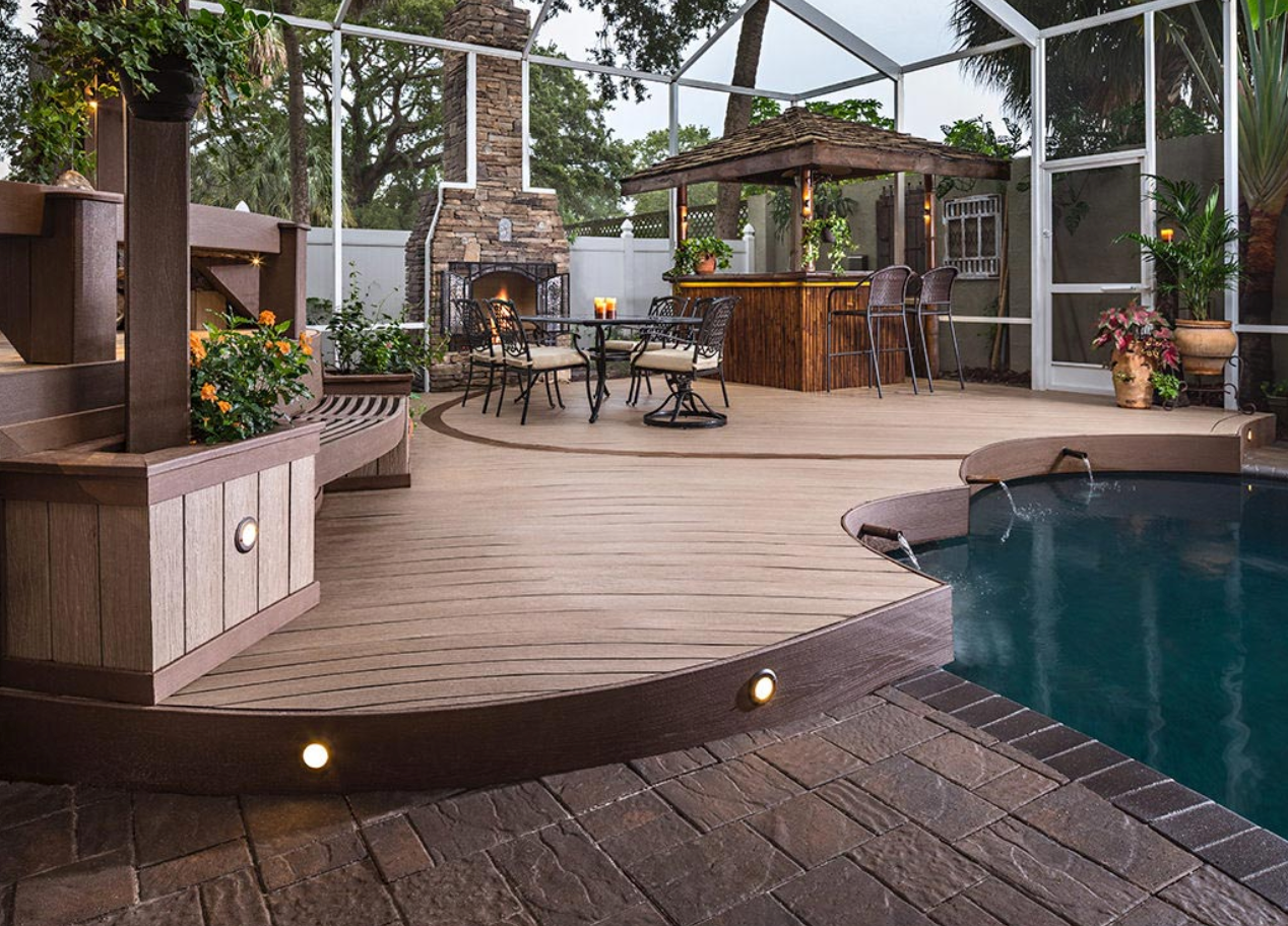 A patio with a swimming pool and a composite wood deck