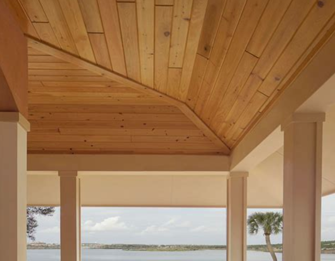 A wooden ceiling with a view of a lake