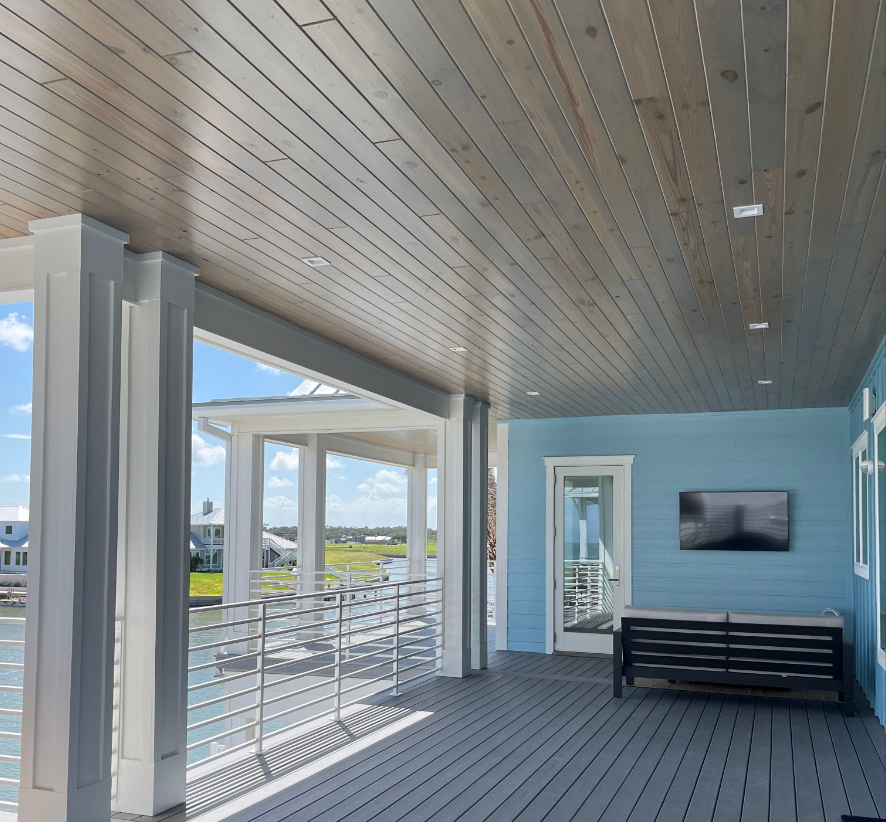 A large porch with a tv on the wall