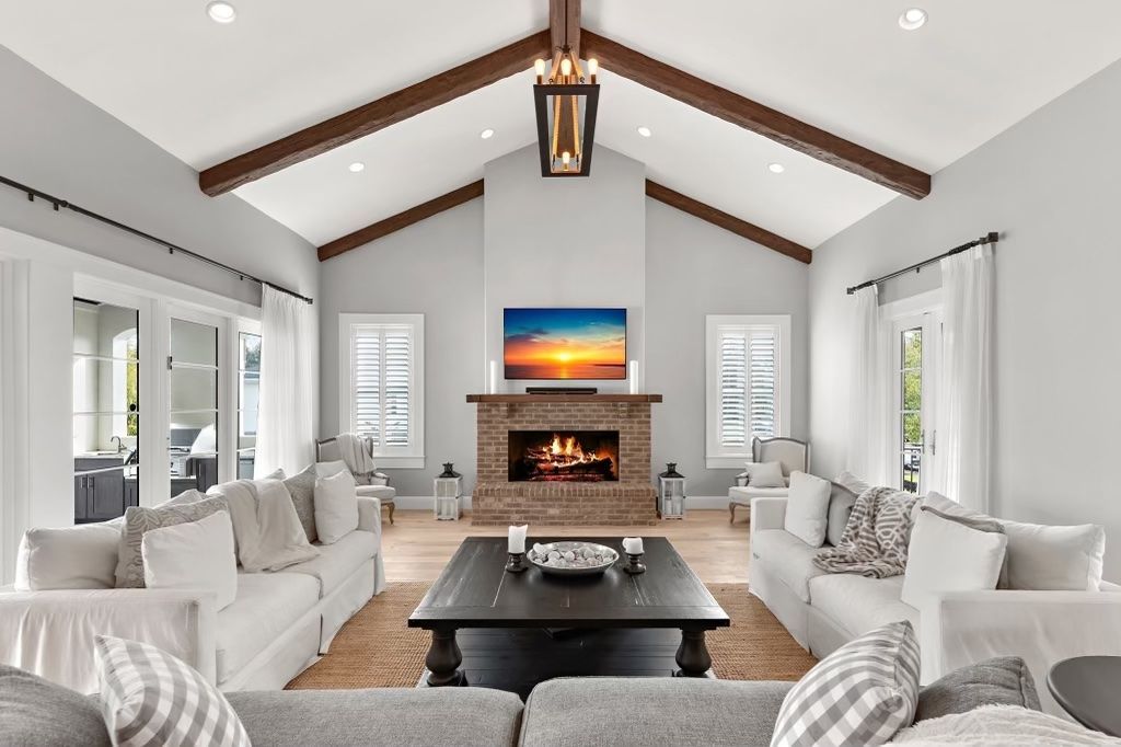 A living room filled with furniture and a fireplace