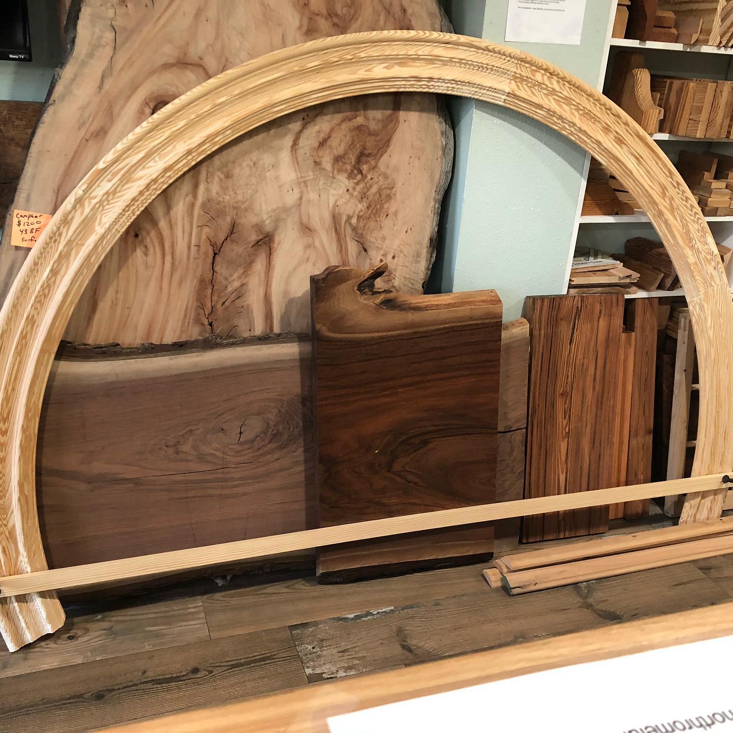A large wooden arch is sitting on a table