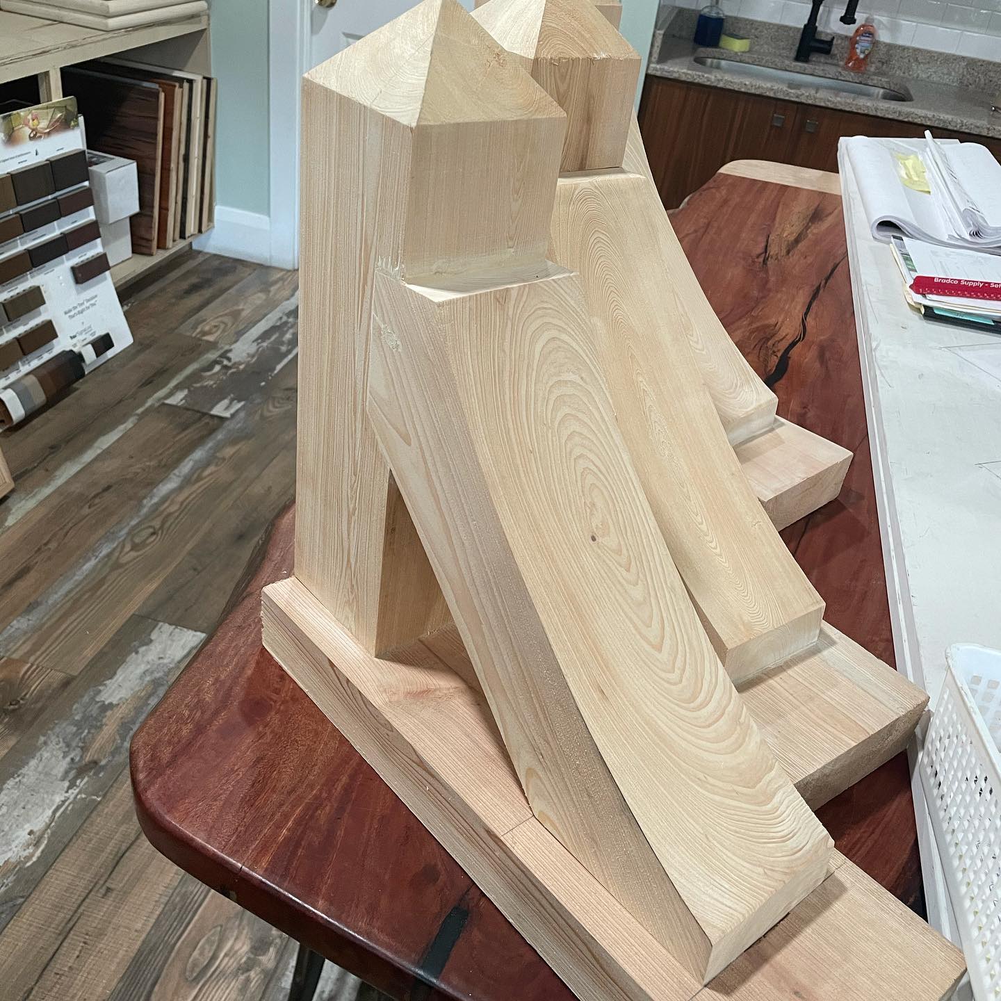 A wooden sculpture is sitting on a wooden table