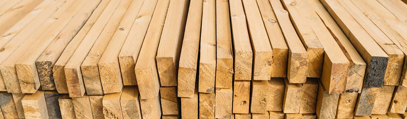 A pile of wooden boards stacked on top of each other.