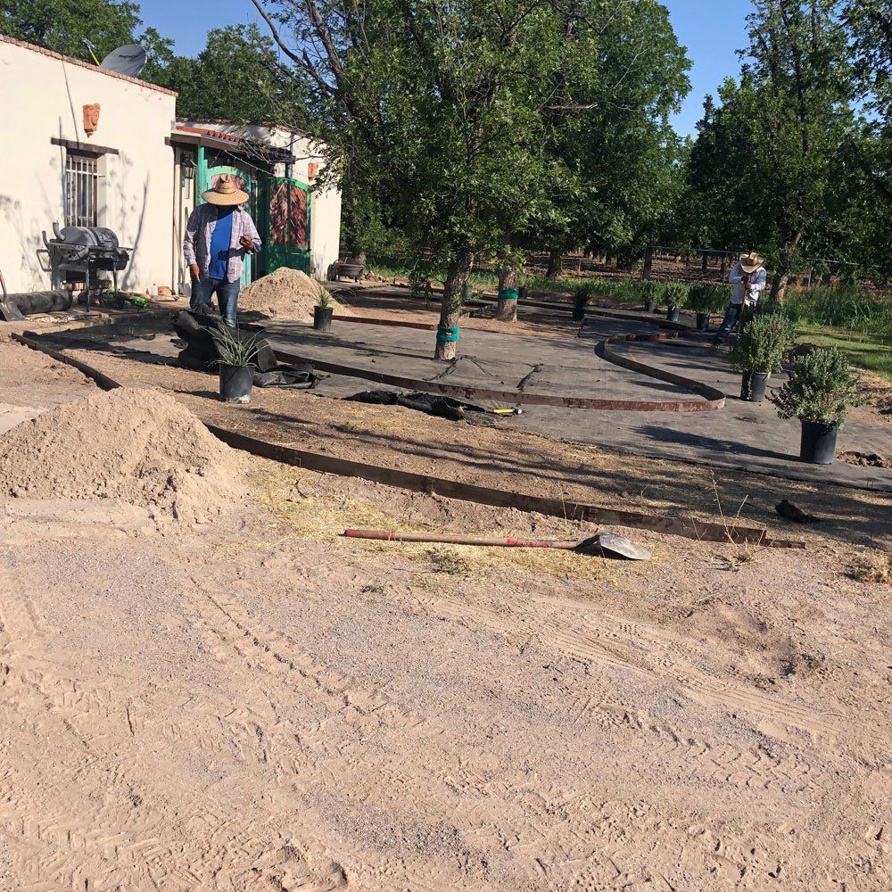 Men Working at The Backyard — Las Cruces, NM — CN Landscaping