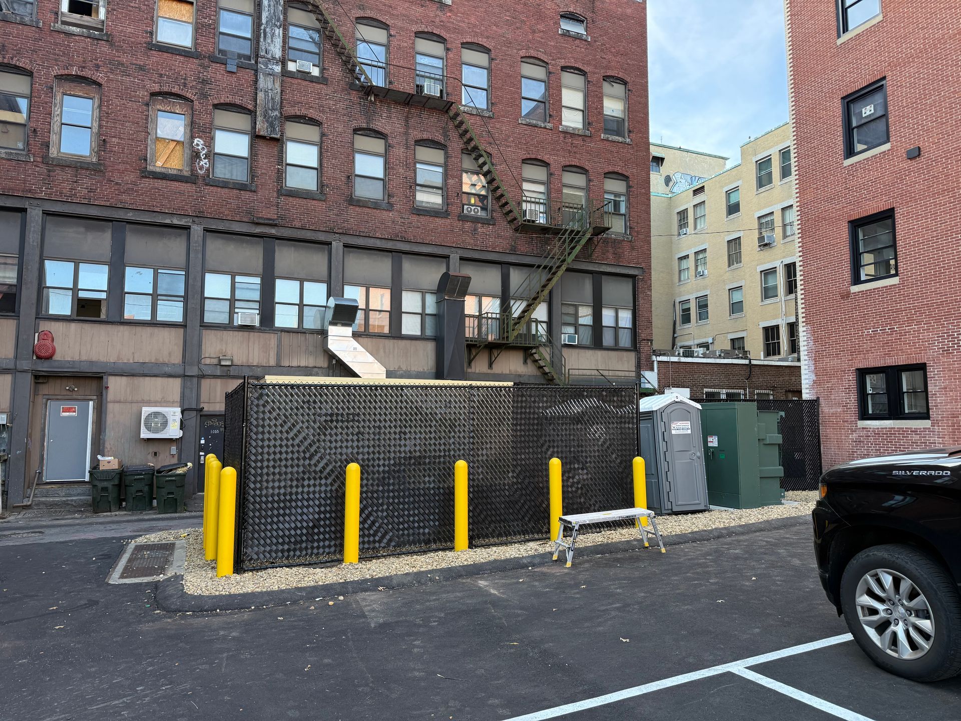 8ft black chain link fence in Manchester NH w/ diagonal black fence tape