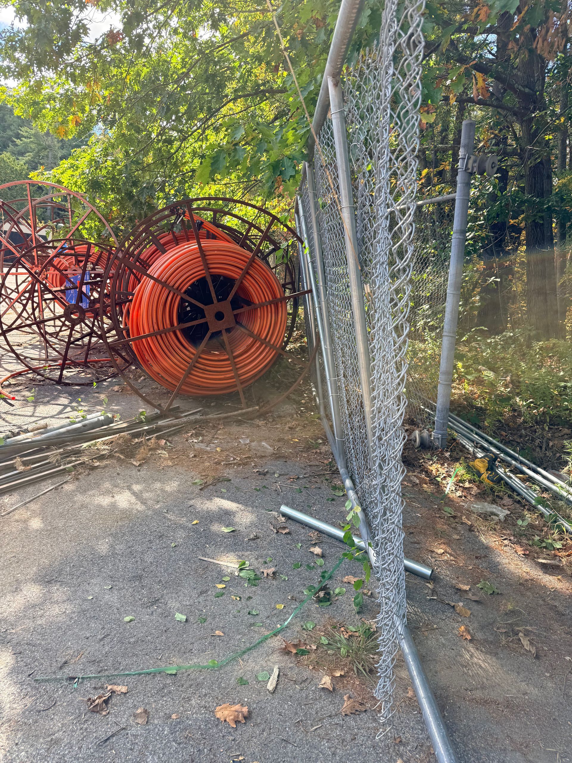rolling gate repair job in Portland Maine. Straitened, welded on site and rolling again pic #1