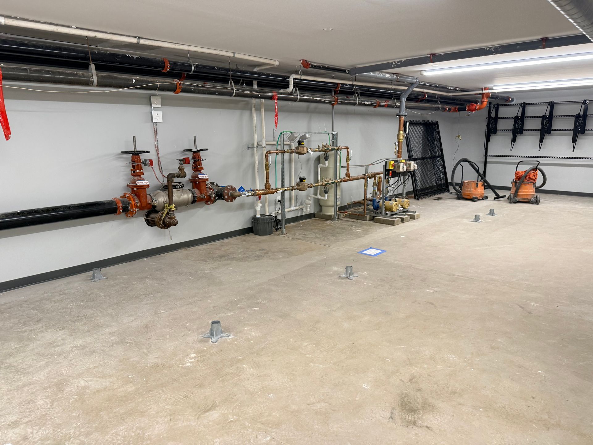 Manchester NH 6ft black chain link fence building sprinkler system enclosure.  pic #1