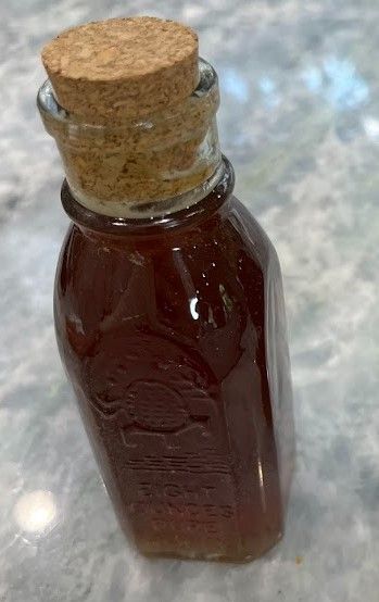 Two 8 oz glass honey jars with cork tops, each hand-sealed with natural beeswax and filled with raw local honey