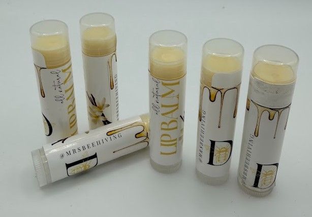 D’s Bees small-batch beeswax lip balms arranged together, featuring honey-inspired packaging and natural flavors