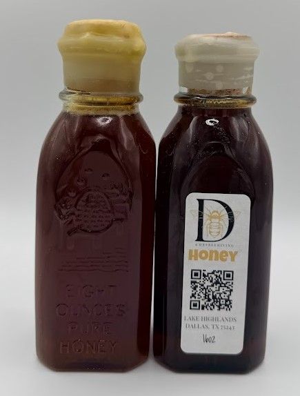 Two 8 oz glass honey jars with cork tops, each hand-sealed with natural beeswax and filled with raw local honey