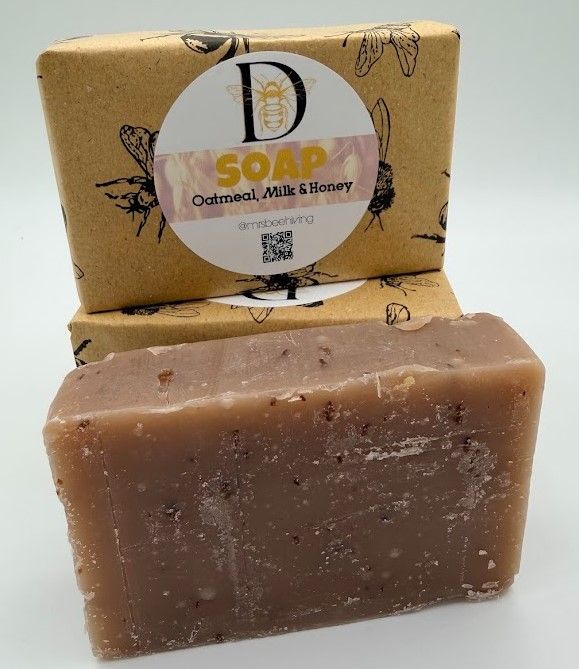 Unwrapped Oatmeal, Milk & Honey soap bar showing natural texture and ground oatmeal