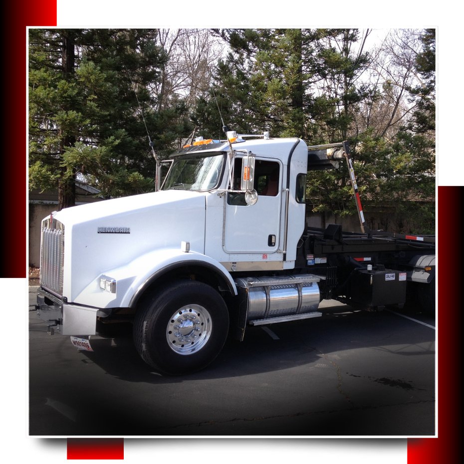 Dumpster truck parked on the road