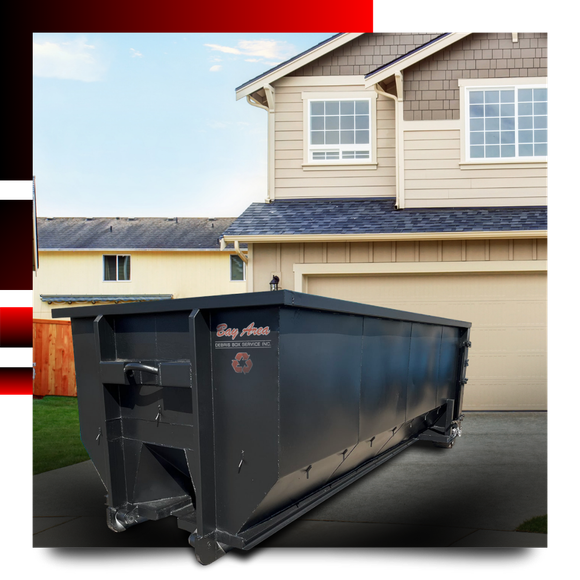 Dumpster in front of a house with graphics behind it.