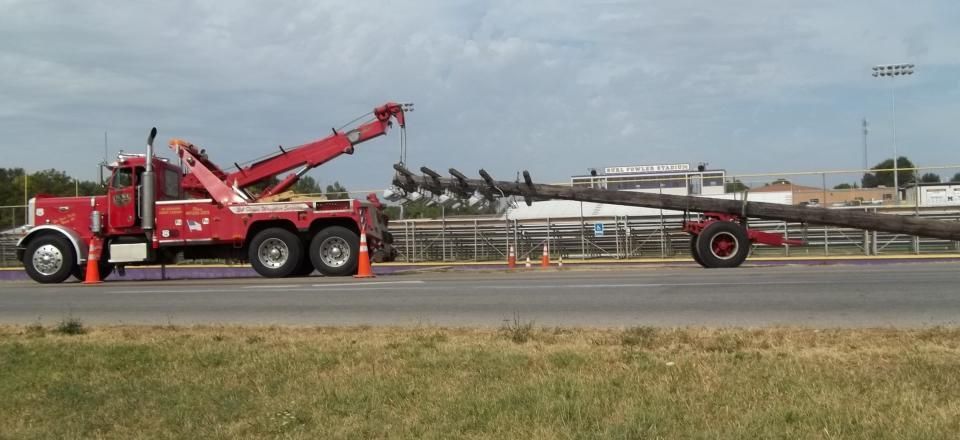 tow truck pulling stadium lights