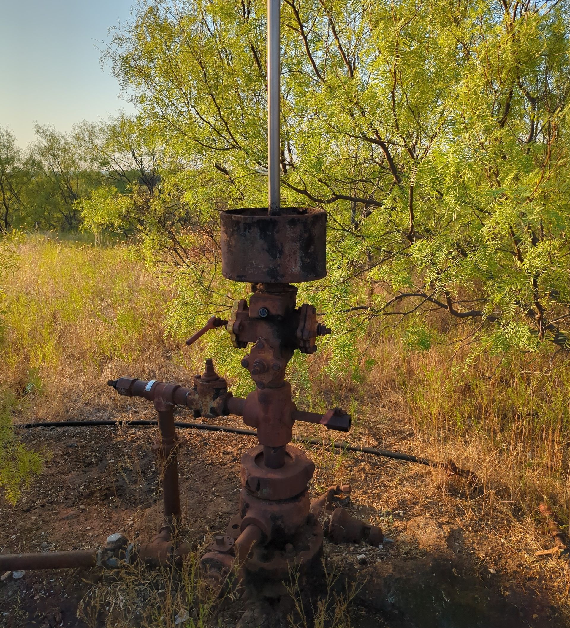 A wellhead in Texas with methane gas emissions