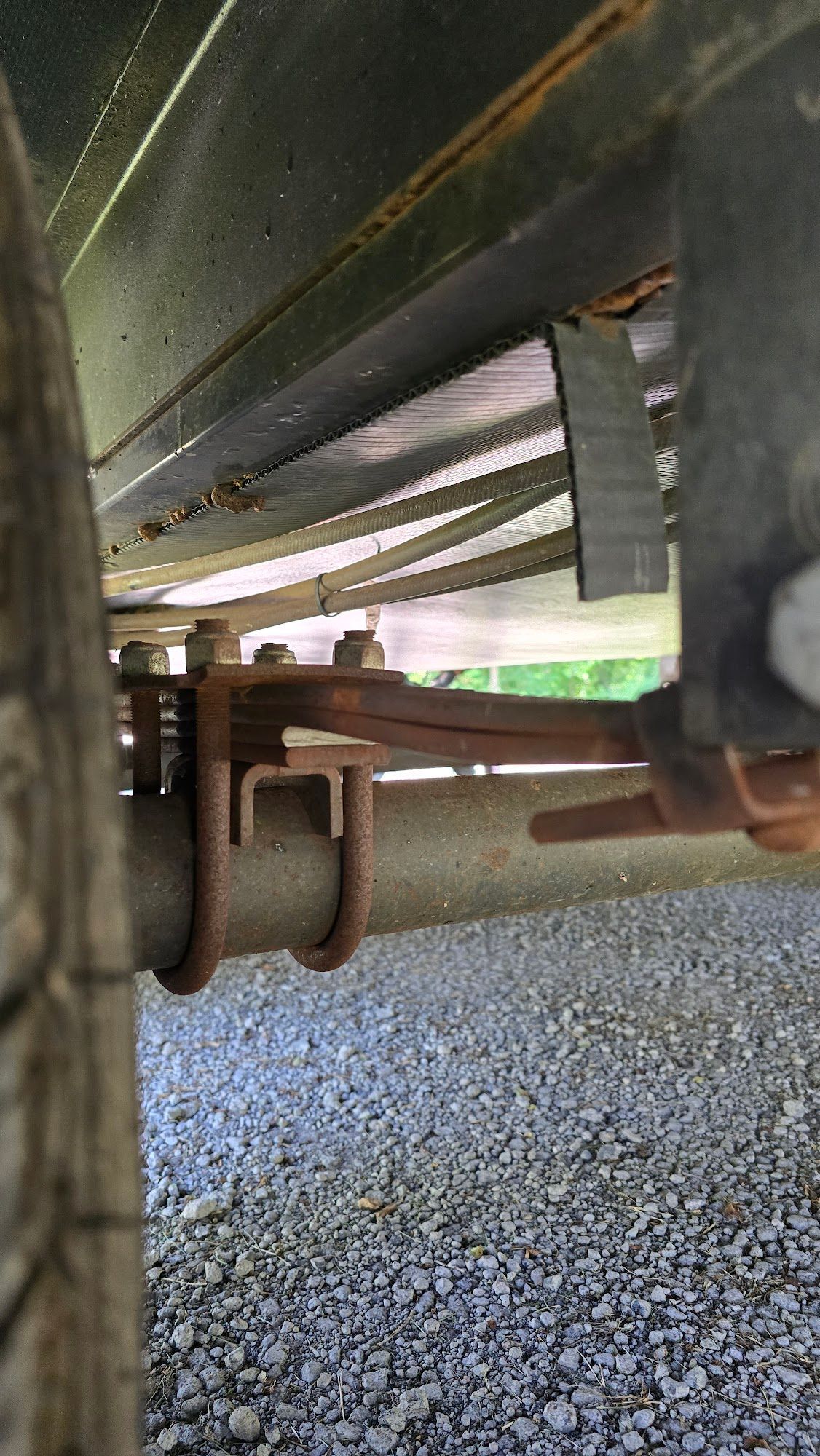 A close up of the underside of a trailer.
