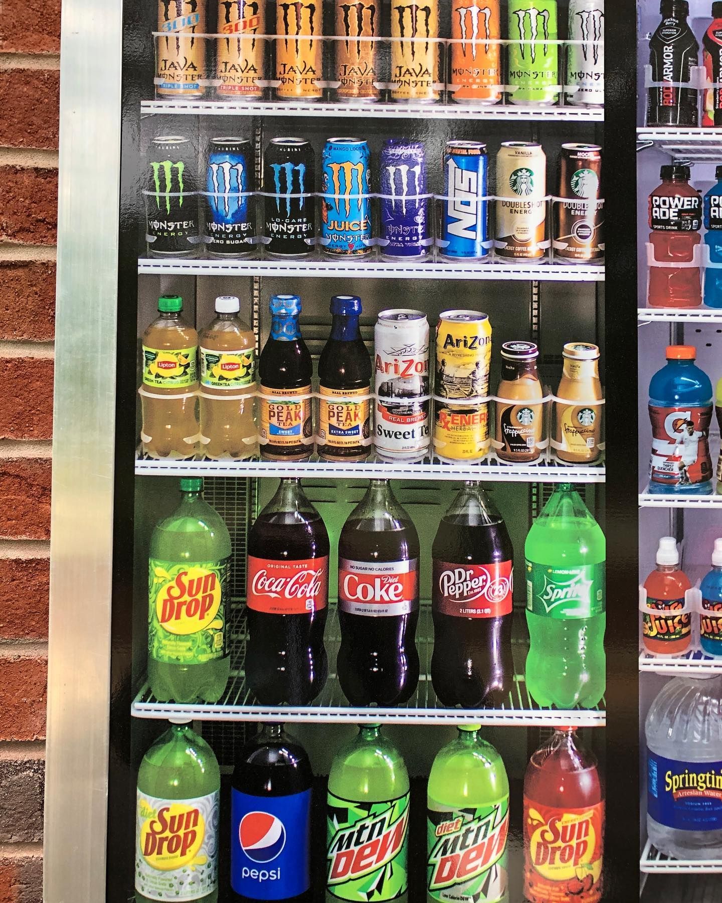 An aerial view of a residential neighborhood with lots of houses and trees.