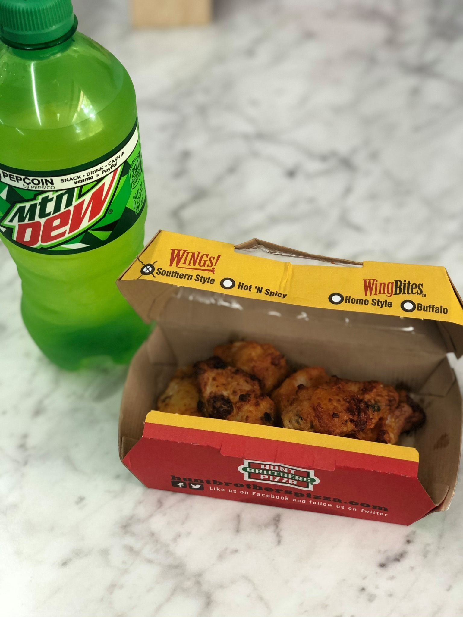 An aerial view of a residential neighborhood with lots of houses and trees.