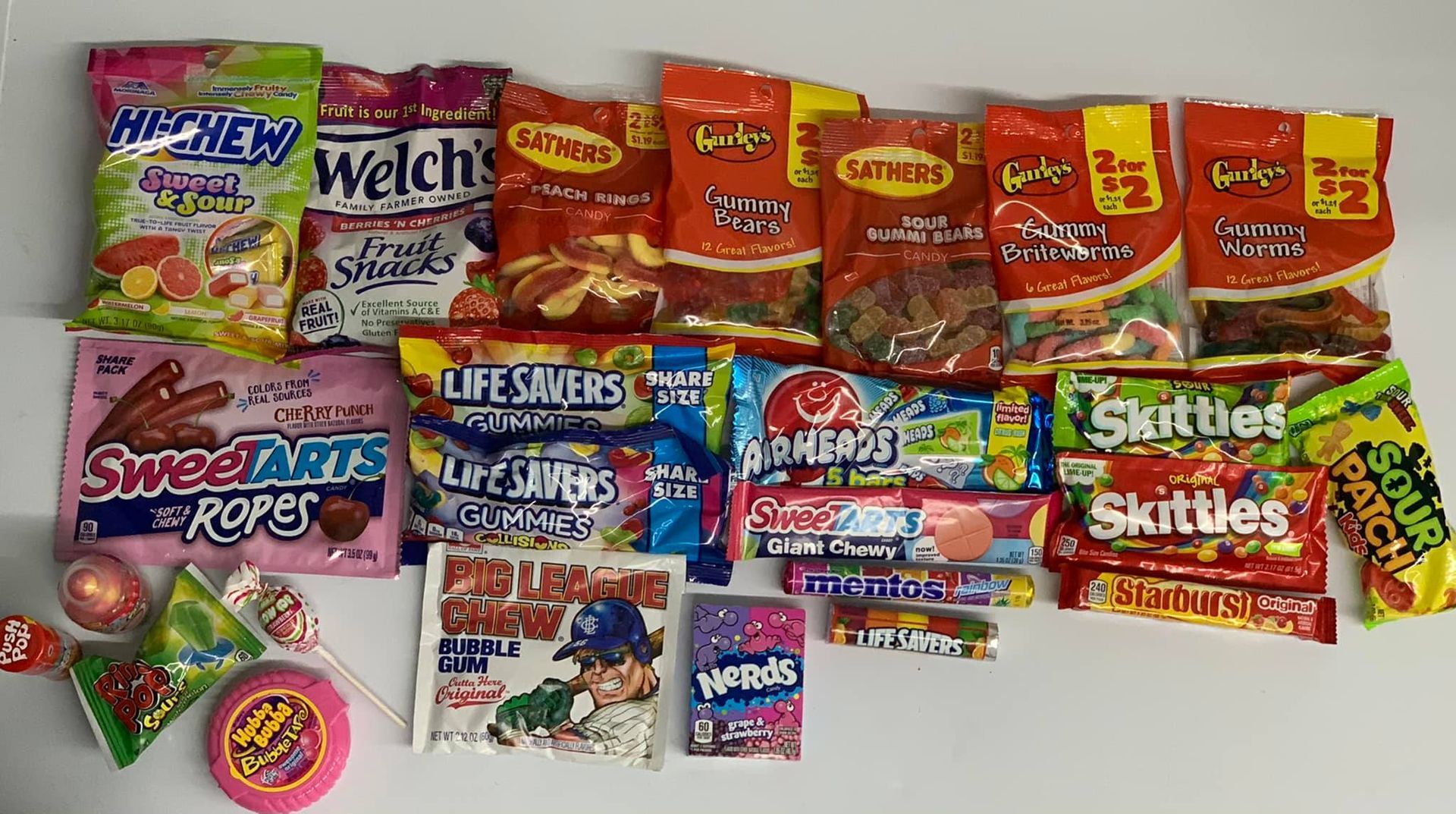 A house with a porch and a car parked in front of it.