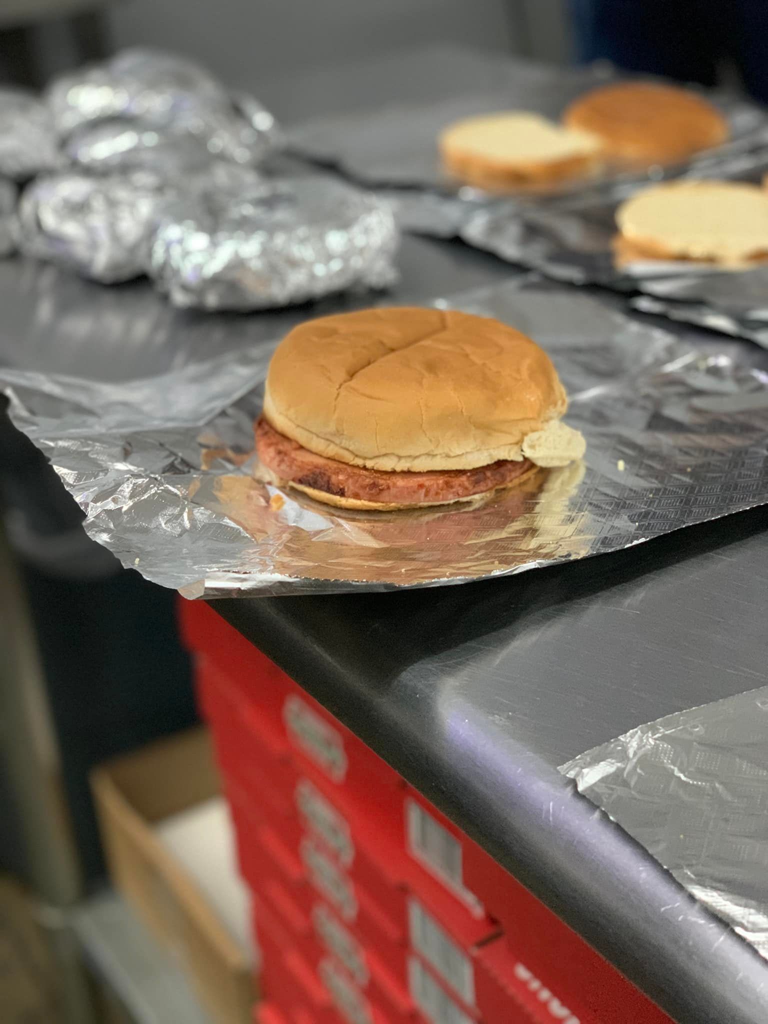 A pair of keys sitting next to a sign that says refinance your mortgage.
