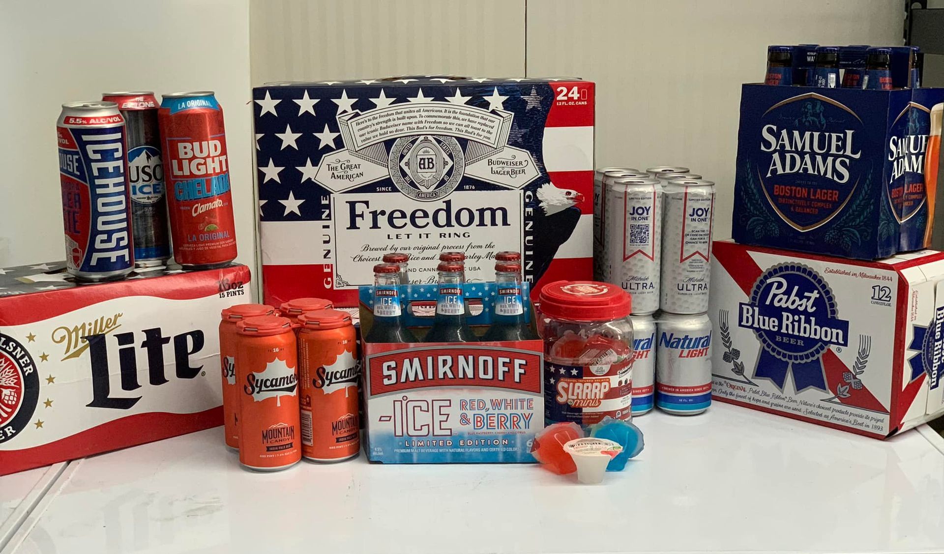 A model house is sitting on top of a pile of money.