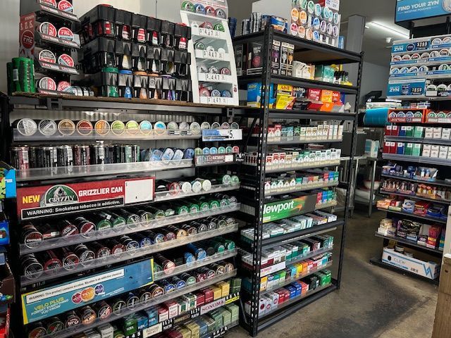 A pair of keys sitting next to a sign that says refinance your mortgage.