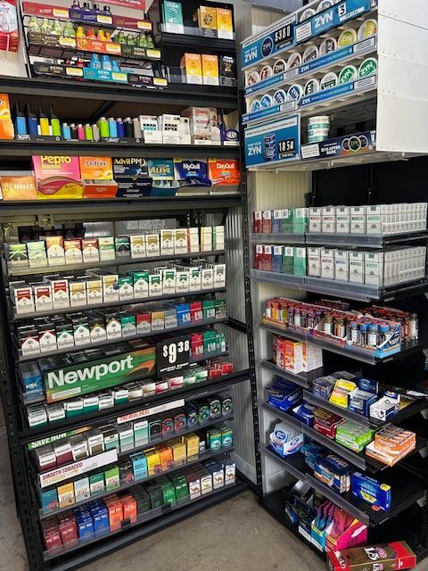 A model house is sitting on top of a pile of money.