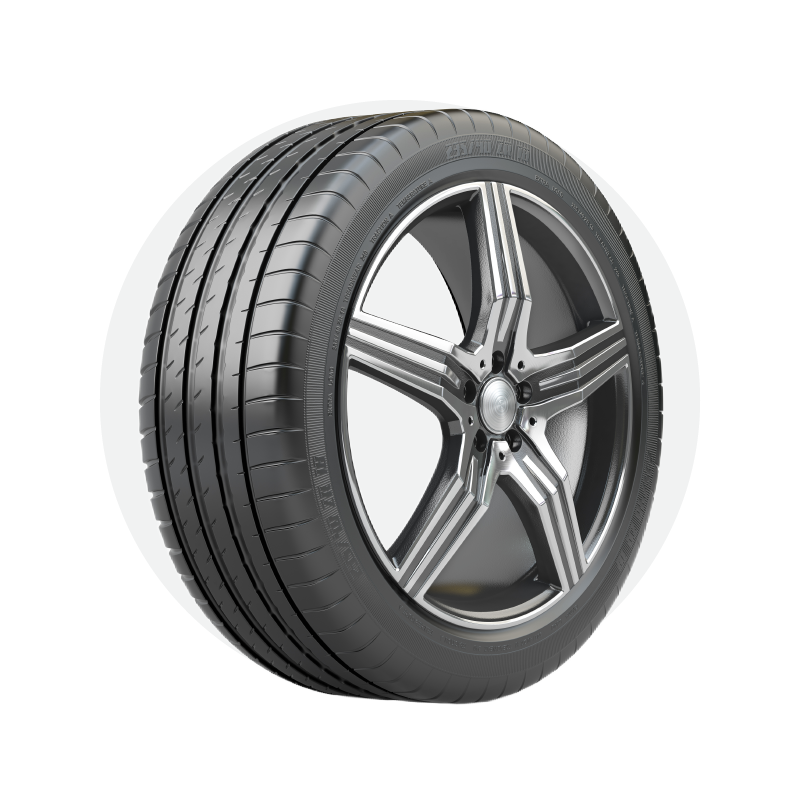 A close up of a tire on a wheel on a white background.