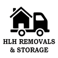 Black icon of a house on a truck, with text 