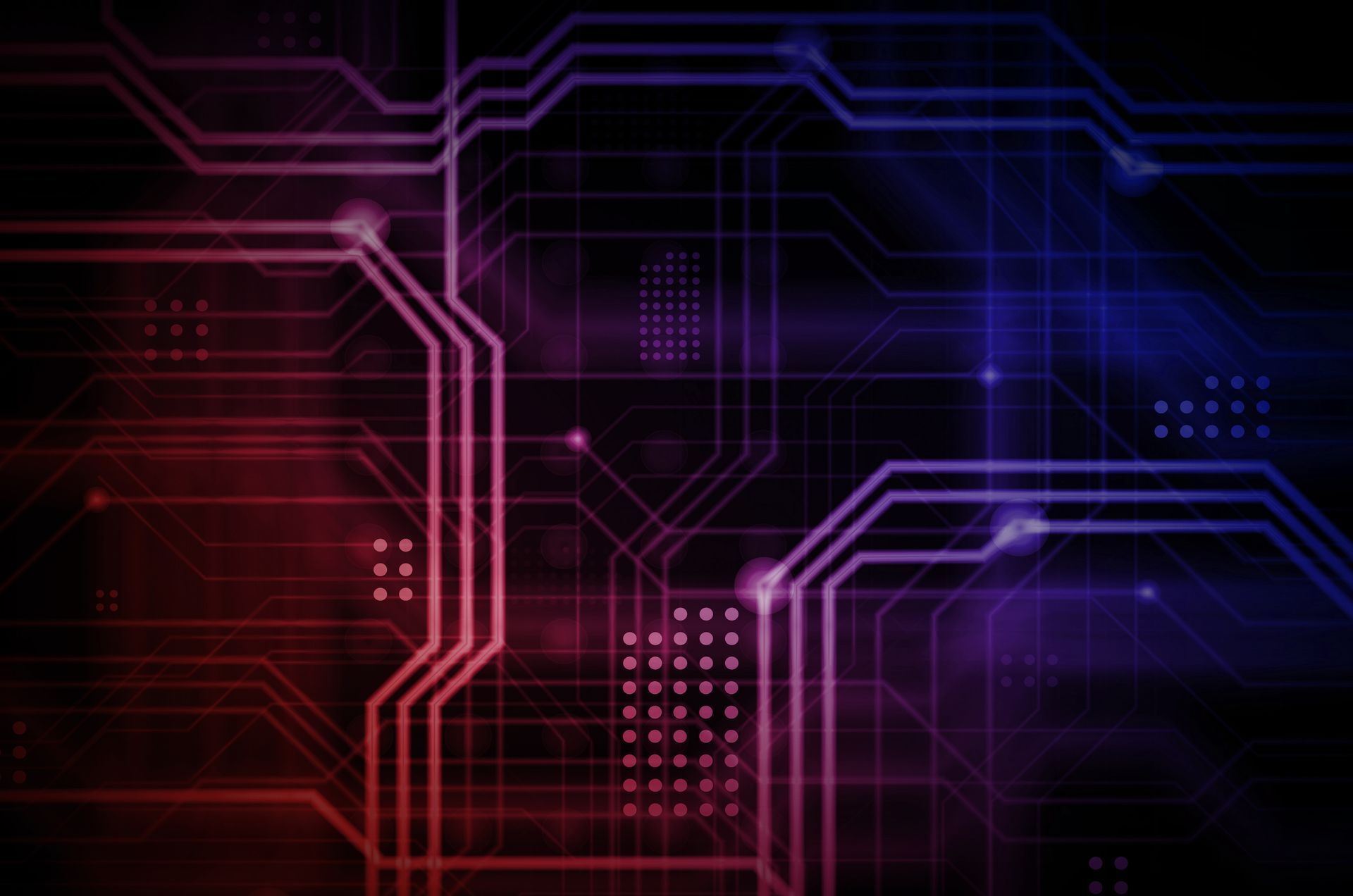 Two people in military uniforms looking at a laptop screen with a map and icons, possibly discussing strategy.